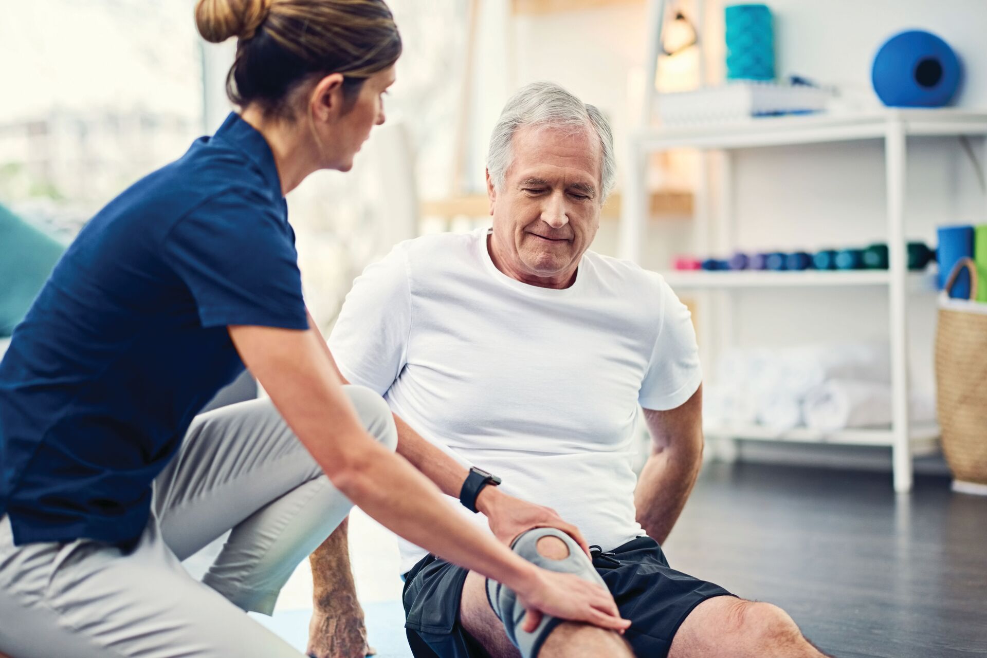 Senior man doing physical therapy exercises