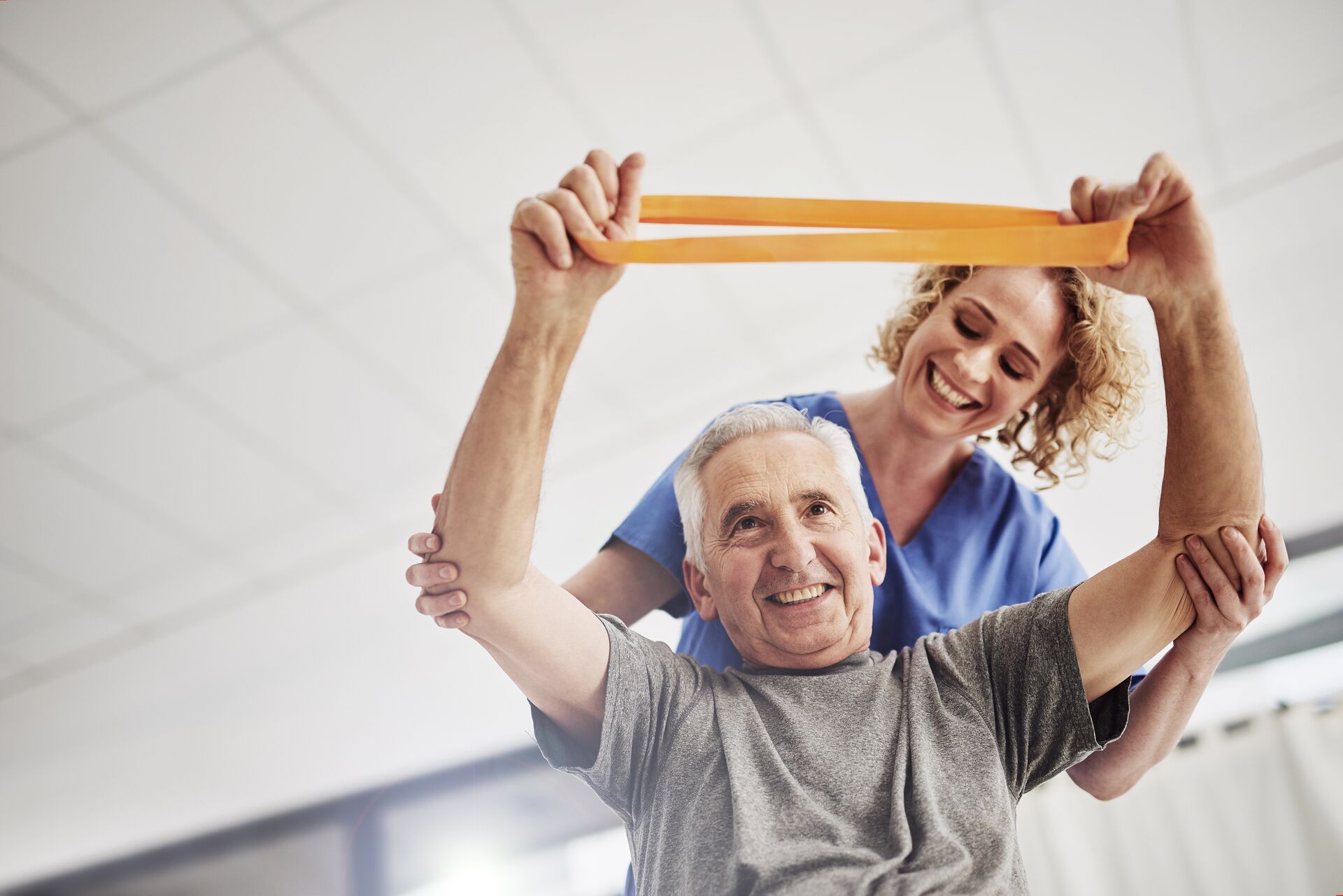 Senior man doing physical therapy exercises