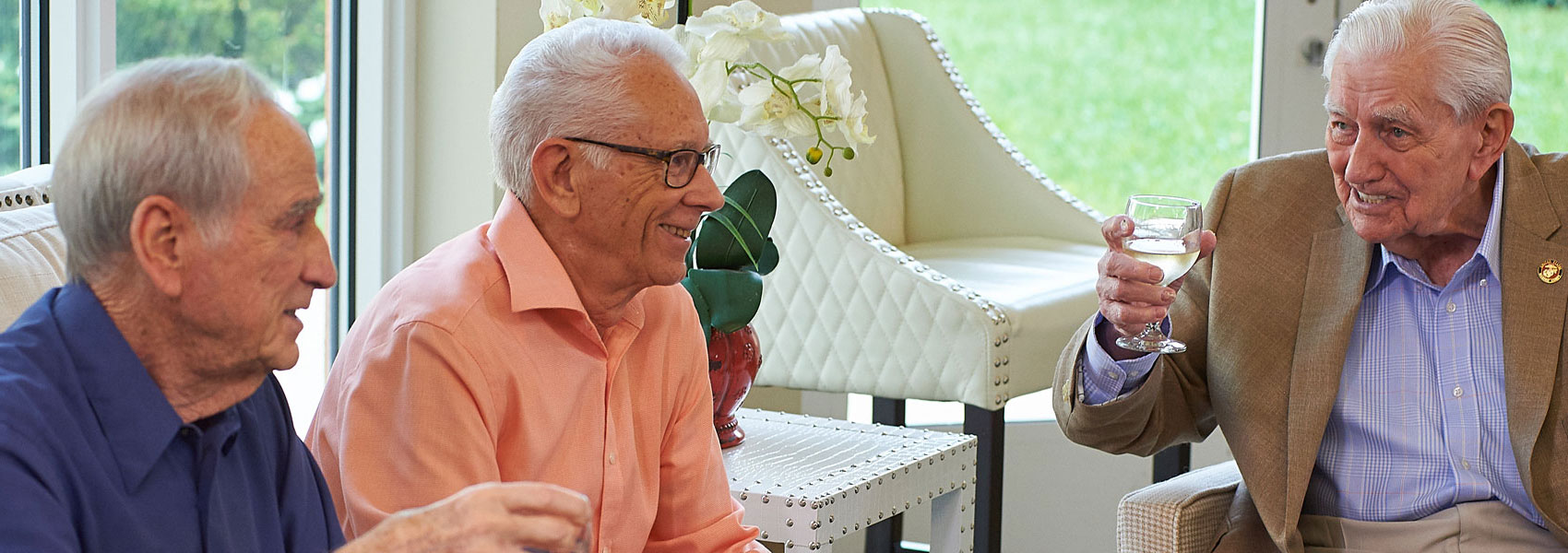 A group of elderly men talking at their Delray Beach retirement community